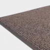 VM-Carpet-Tweed-197-tummanharmaa Tummanharmaa VM Carpet Tweed matto. Lähikuva maton kulmasta, josta näkyy kanttaus ja maton materiaali.