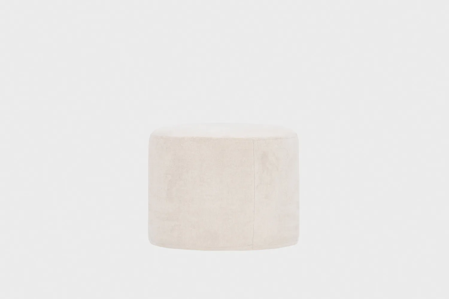 Beige pyöreä rahi, joka on 50 cm leveä ja sen korkeus on 40 cm.